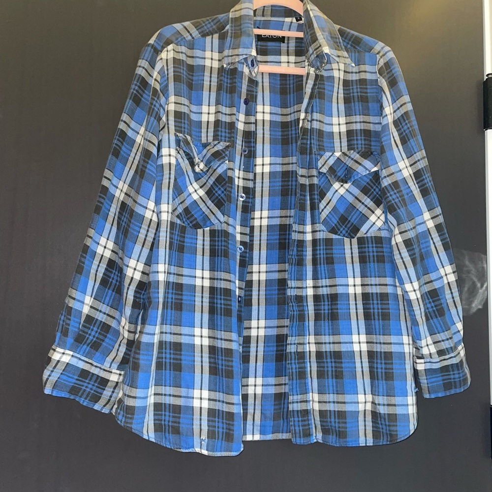 Plaid shirt with pulp fiction on the back